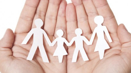 Paper people in hands
